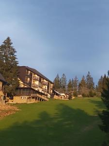 a large house with a large green yard at Vlašićka priča Eko Fis in Vlasic