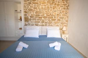 A bed or beds in a room at Anastasia Traditional House