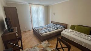 Posteľ alebo postele v izbe v ubytovaní Dalma Apartment