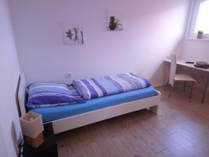 Postel nebo postele na pokoji v ubytování Pension An der Reling