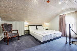 Ένα ή περισσότερα κρεβάτια σε δωμάτιο στο Хотел Паризи