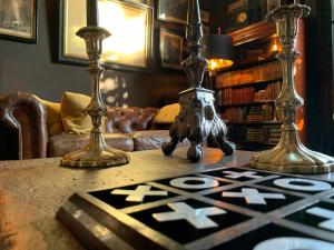 a table with two vases on top of a table at 23 Mayfield in Edinburgh