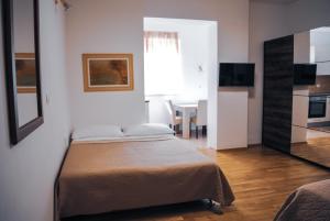 Postel nebo postele na pokoji v ubytování Royal Deluxe
