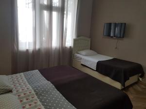 Letto o letti in una camera di MIDIA Guest House