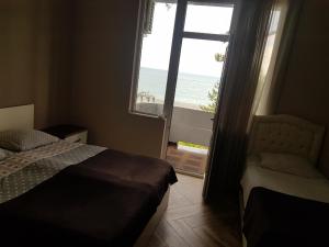 Letto o letti in una camera di MIDIA Guest House