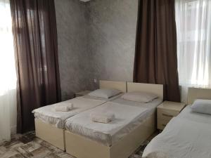 Letto o letti in una camera di MIDIA Guest House