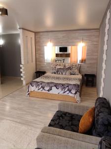 a bedroom with two beds with zebra pillows at Apartment VIP in Tiraspol
