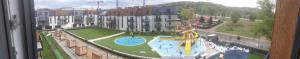 a view of a water park with a playground at Bel Mare - Muszelka in Międzyzdroje
