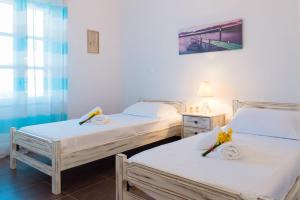 Postel nebo postele na pokoji v ubytování Petala House