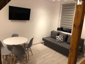 Posedenie v ubytovaní Apartament przy Parku Zdrojowym