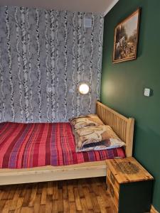 A bed or beds in a room at Bora Zdrój - apartament
