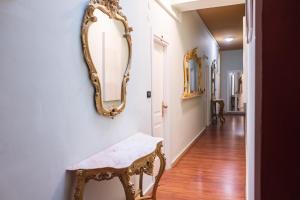 a room with a table, chairs and a mirror at Hotel Miramare in Noli