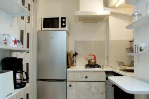 A kitchen or kitchenette at Monolocali In Casa Con Giardino Bellagio