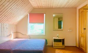 Ένα ή περισσότερα κρεβάτια σε δωμάτιο στο Anykščių raj. Žalioji Stotelė +67 φωτογραφίες