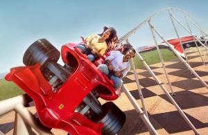 a group of people riding on a ride at a playground at Copthorne Downtown by Millennium in Abu Dhabi
