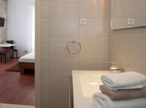Kylpyhuone majoituspaikassa Rooms Supreme Spalato