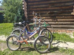 two bikes parked next to each other in front of a building at House Liteyschika Nikulicheva with Banya in Suzdal