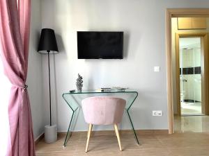 A television and/or entertainment centre at Melenia Suites