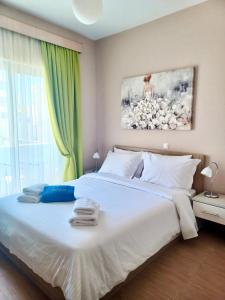 Ένα ή περισσότερα κρεβάτια σε δωμάτιο στο Melenia Suites