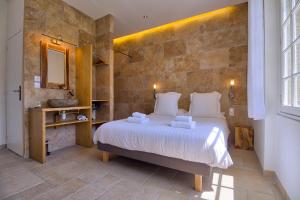 a bedroom with a bed and a mirror and a sink at GOOD KNIGHT in Carcassonne +22 photos