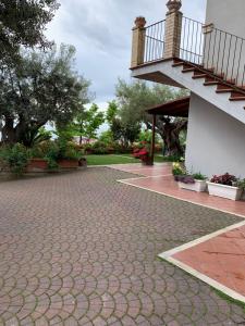 a brick walkway with a staircase on the side of a building at Casa di Mary in Grottammare