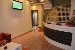 TV a/nebo společenská místnost v ubytování Hotel Mustang