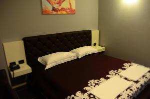 Postel nebo postele na pokoji v ubytování Hotel Mustang