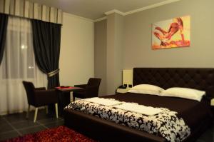 Postel nebo postele na pokoji v ubytování Hotel Mustang