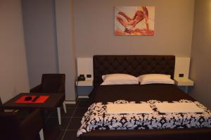 Postel nebo postele na pokoji v ubytování Hotel Mustang