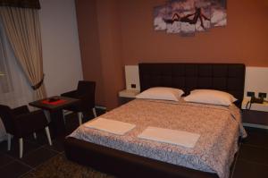 Postel nebo postele na pokoji v ubytování Hotel Mustang