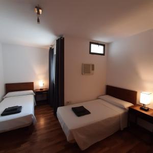 Posteľ alebo postele v izbe v ubytovaní Habitaciones La MAR