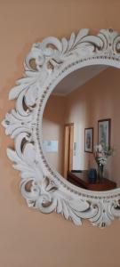 a large white mirror hanging on a wall at CasAzulApartments in Sintra