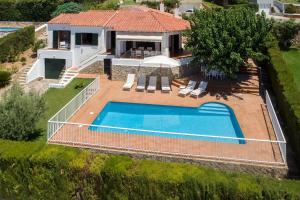 an aerial view of a house with a swimming pool at Villa Anna 12B in Son Bou