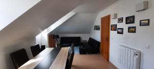 a living room with a table and chairs at CasAzulApartments in Sintra