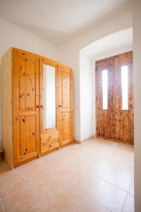 a room with wooden doors and a tile floor at Ubytování Rožmberk nad Vltavou 18 in Rožmberk nad Vltavou