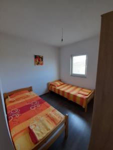 Cama o camas de una habitación en Apartman Boki