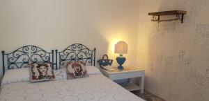 Ένα ή περισσότερα κρεβάτια σε δωμάτιο στο Dimora Quattro Vanelle