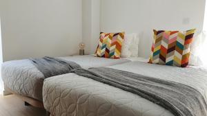 Postel nebo postele na pokoji v ubytování Welcome Home Aveiro