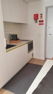 Kuchyň nebo kuchyňský kout v ubytování Welcome Home Aveiro