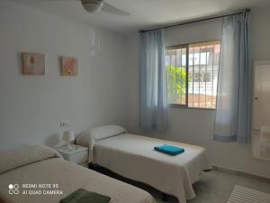Posteľ alebo postele v izbe v ubytovaní CASA SANTO a 2 minutos de la playa a pié y parking gratuito