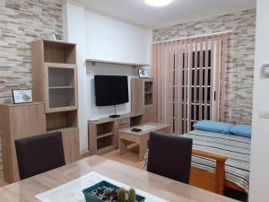 TV a/nebo společenská místnost v ubytování Casa Herrera