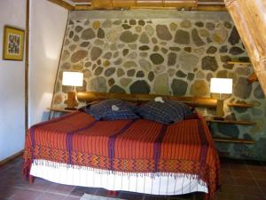 A bed or beds in a room at Reserva Natural Atitlan