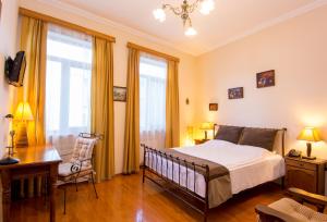 Postel nebo postele na pokoji v ubytování Hotel British House