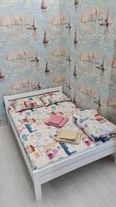 Ένα ή περισσότερα κρεβάτια σε δωμάτιο στο Appartment Grecheskaya 45/40