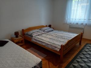 Posteľ alebo postele v izbe v ubytovaní Domček pod Kalváriou