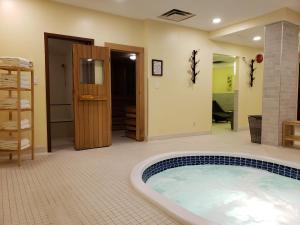 a large bathroom with a hot tub in a room at Sun Peaks Lodge in Sun Peaks