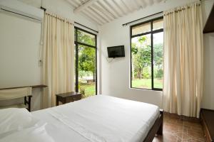 Voodi või voodid majutusasutuse Hostal Suna Vito toas