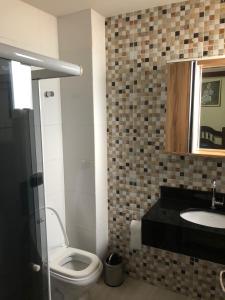 Ванная комната в Apartamento Guarapari Luxo Frente para o Mar