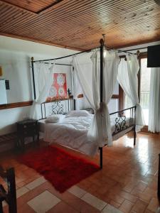 Postel nebo postele na pokoji v ubytování Αρχοντικό Κονάκι- Konaki Pelion