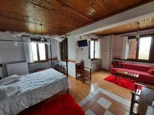 Postel nebo postele na pokoji v ubytování Αρχοντικό Κονάκι- Konaki Pelion